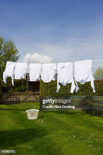 wasing haning on line - clothesline imagens e fotografias de stock