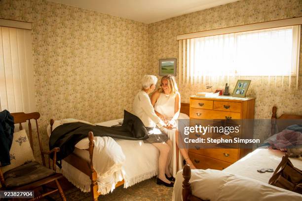 great grandmother talks to young woman on wedding day - window dresser stock pictures, royalty-free photos & images