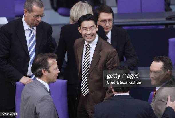 Philipp Roesler , new German Health Minister designate and member of the German Free Democrats political party, chats with parliamentarians at the...