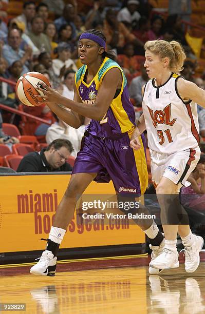 Nikki Teasley of the Los Angeles Sparks is followed by Debbie Black of the Miami Sol during the WNBA game on May 30, 2002 at American Airlines Arena...
