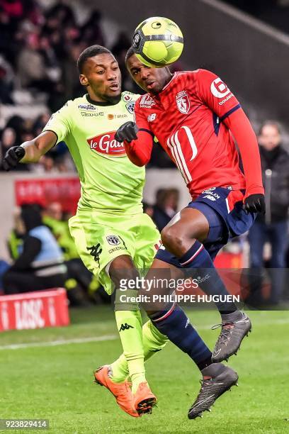 Angers' Cameroun forward Karl Toko Ekambi vies with Lille's French defender Fode Ballo-Toure during the French L1 football match Lille vs Angers on...
