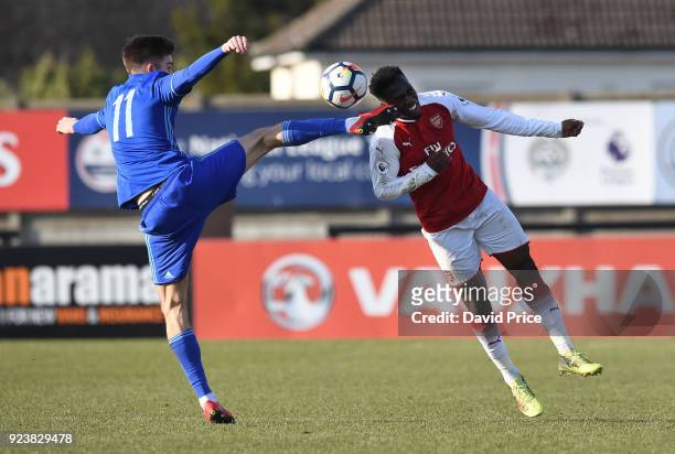 Tolaji Bola of Arsenal challenges Mario Cuze of Dinamo for the ball during the match between Arsenal and Dinamo Zagreb at Meadow Park on February 24,...