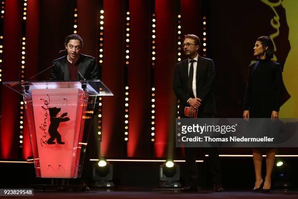 Jury members of GWFF Best First Feature Award Jonas Carpignano, Calin Peter Netzer and Noa Regev are seen on stage at the closing ceremony during the...