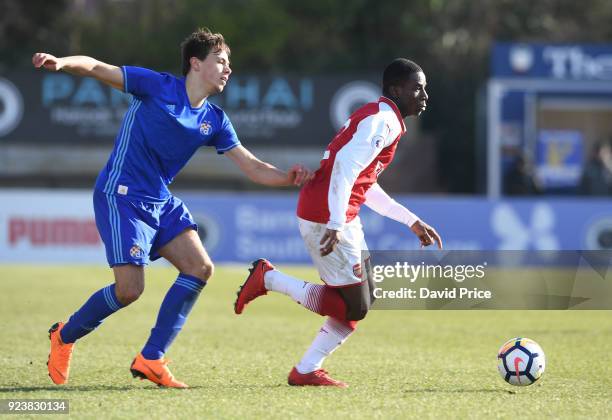 Jordi Osei-Tutu of Arsenal takes on Dario Spikic of Dinamo during the match between Arsenal and Dinamo Zagreb at Meadow Park on February 24, 2018 in...