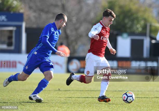 Vlad Dragomir of Arsenal takes on Marijan Cabraja of Dinamo during the match between Arsenal and Dinamo Zagreb at Meadow Park on February 24, 2018 in...