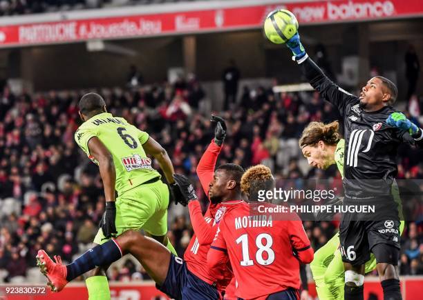Lille's French goalkeeper Mike Maignan save the ball during the French L1 football match Lille vs Angers on February 24 2018 at the Pierre Mauroy...