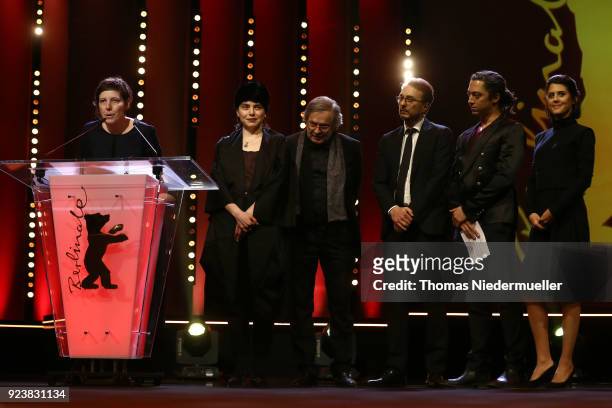 Bianca Oana winner of the GWFF Best First Feature Award for 'Touch me not' speaks on stage next to Philippe Avril and Adina Pintilie and jury members...