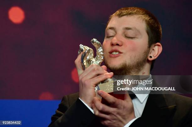 French actor Anthony Bajon poses with his Silver Bear for Best Actor he received for his role in the movie "La priere" during a press conference...