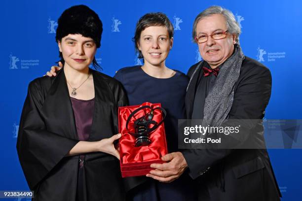 Bianca Oana, Adina Pintilie and Philippe Avril pose with the Golden Bear award for Best Film 'Touch Me Not' at the award winners photo call during...