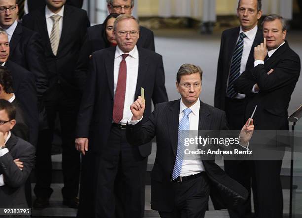 Chairman of the German Free Democrats and new German Vice Chancellor and Foreign Minister designate Guido Westerwelle gestures at the first session...