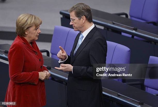 Chairman of the German Free Democrats and new German Vice Chancellor and Foreign Minister designate Guido Westerwelle and German Chancellor and...