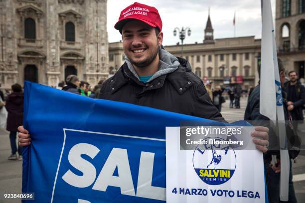 An attendee wearing a "Make America Great Again" hat stands for a photograph during an election campaign rally for The League party at Duomo Square...