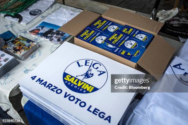 Campaign merchandise is displayed for sale during an election campaign rally for The League party at Duomo Square in Milan, Italy, on Saturday, Feb....
