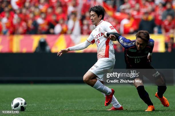 Tamada Keiji of Nagoya Grampus and Kurata Shu of Gamba Osaka during the J.League J1 match between Gamba Osaka and Nagoya Grampus at Suita City...