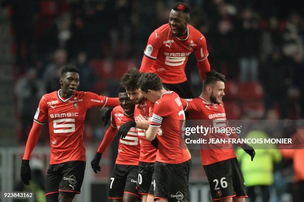 Rennes' French midfielder Sanjin Prcic is congratulated by teammates after scoring a goal during the French L1 football match between Guingamp and...