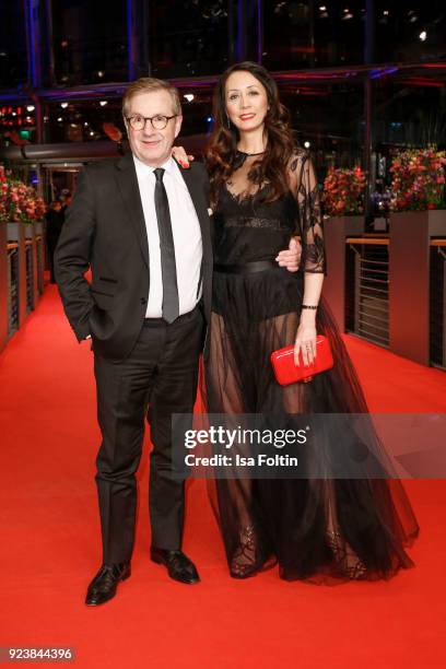 German news anchor Jan Hofer and his partner Phong Lan attend the closing ceremony during the 68th Berlinale International Film Festival Berlin at...
