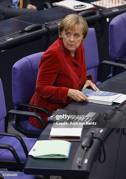 German Chancellor and Chairwoman of the German Christian Democrats Angela Merkel attends at the first session of the new Bundestag on October 27,...