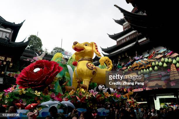 Huge gold dog lantern, 9 meters high and more than 1 ton weigh, stands in the center of Yu garden square. 2018 Shanghai Yu Garden Lantern Show, the...