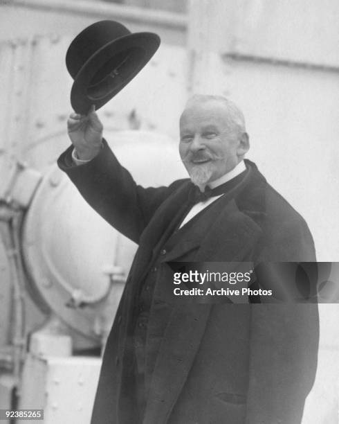French Professor of Applied Psychology Emile Coue waves from the deck of a ship, circa 1923.