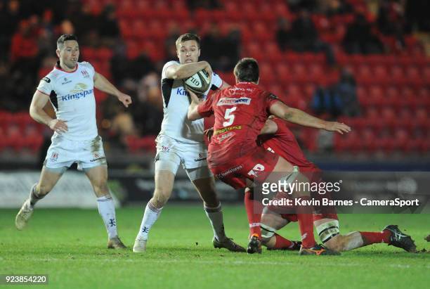 Ulster's Jonny McPhillips under pressure from Scarlets' David Bulbring and Steven Cummins during the Guinness Pro14 Round 16 match between Scarlets...