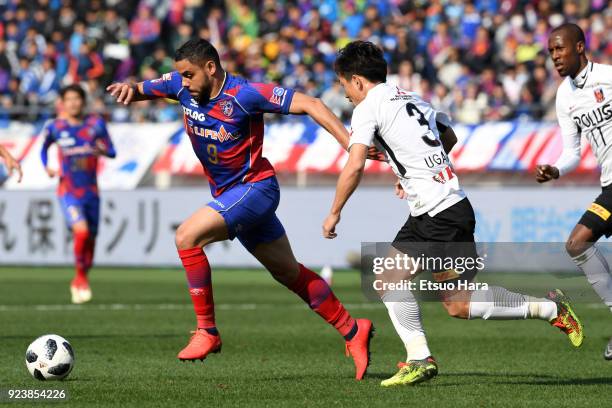 Diego Oliveira of FC Tokyo and Tomoya Ugajin of Urawa Red Diamonds compete for the ball during the J.League J1 match between FC Tokyo and Urawa Red...