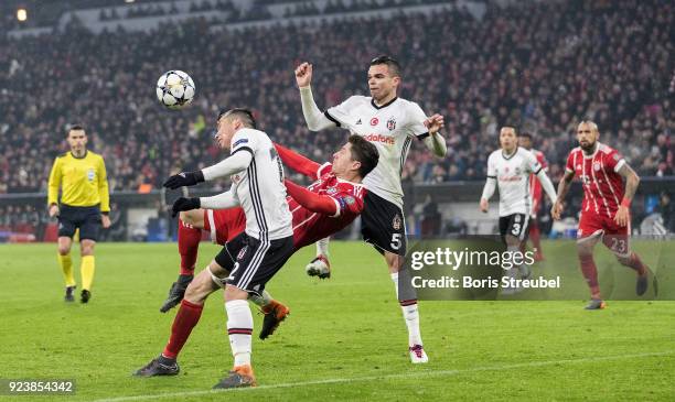 Robert Lewandowski of FC Bayern Muenchen is challenged by Gary Medel of Besiktas Istanbul and Pepe of Besiktas Istanbul during the UEFA Champions...