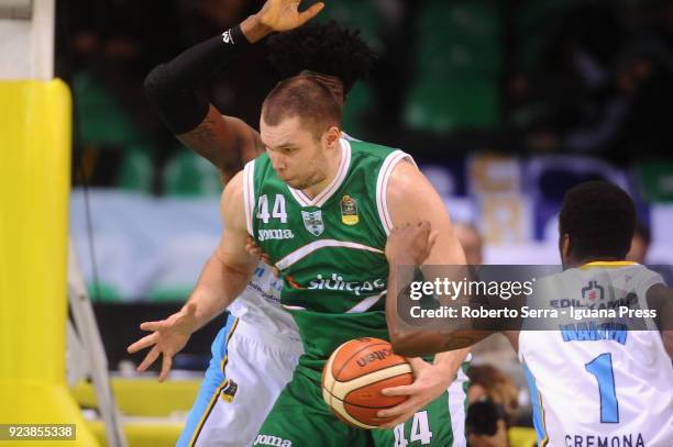 Kyrylo Fesenko of Sidigas competes with Henry Sims and Kelvin Martin of Vanoli during the match quarter final of Coppa Italia between Scandone...