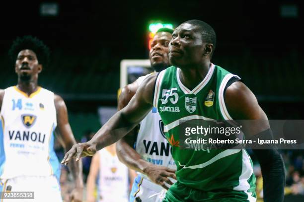 Hamady Ndiaye of Sidigas competes with Kelvin Martin and Henry Sims of Vanoli during the match quarter final of Coppa Italia between Scandone Sidigas...