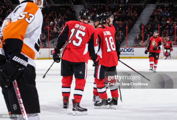 Ryan Dzingel of the Ottawa Senators celebrates his third period goal against the Philadelphia Flyers with teammates Zack Smith and Cody Ceci at...