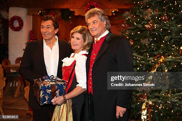 Ruediger Wolff, Marianne Hartl and Michael Hartl pose during a 'Christmas With Marianne And Michael' show taping photocall at Ellmauer Alm Sporthotel...