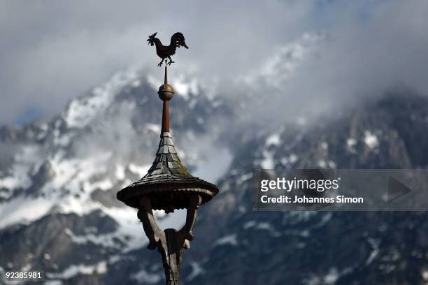 Traditional Alpine fire bell roof tower is seen in front of the Wilder Kaiser mountains on October 27, 2009 in Ellmau, Austria.