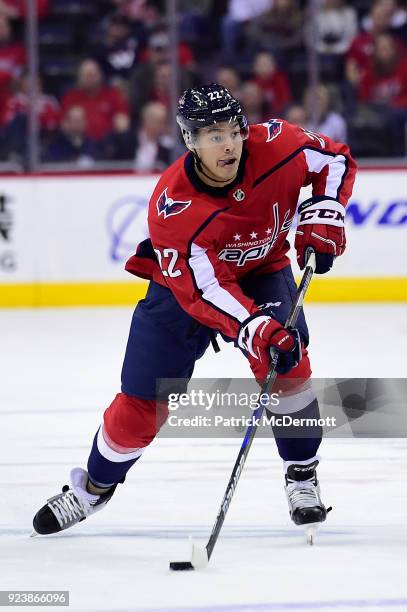 Madison Bowey of the Washington Capitals skates with the puck in the first period against the Tampa Bay Lightning at Capital One Arena on February...