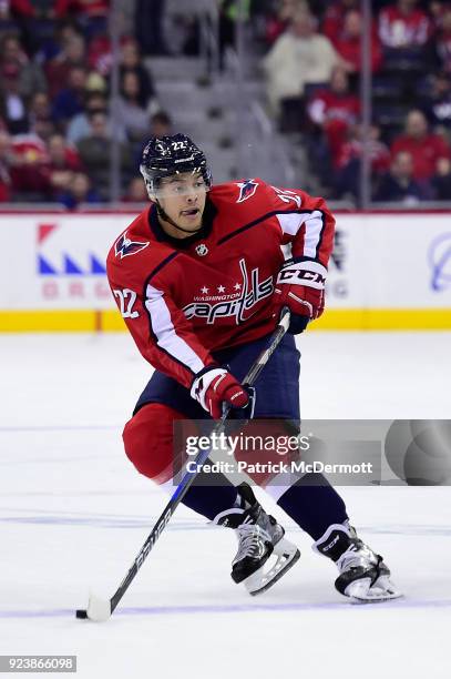 Madison Bowey of the Washington Capitals skates with the puck in the first period against the Tampa Bay Lightning at Capital One Arena on February...