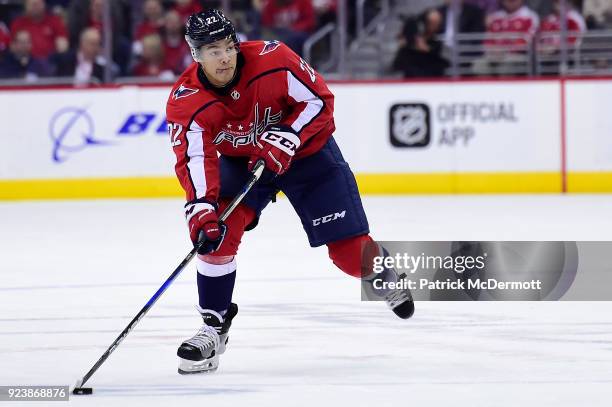 Madison Bowey of the Washington Capitals skates with the puck in the first period against the Tampa Bay Lightning at Capital One Arena on February...