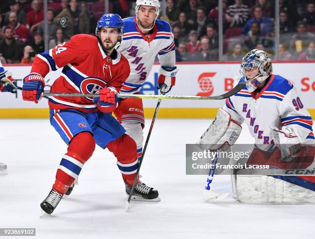 Phillip Danault of the Montreal Canadiens attempts to deflect the puck the New York Rangers in the NHL game at the Bell Centre on February 22, 2018...