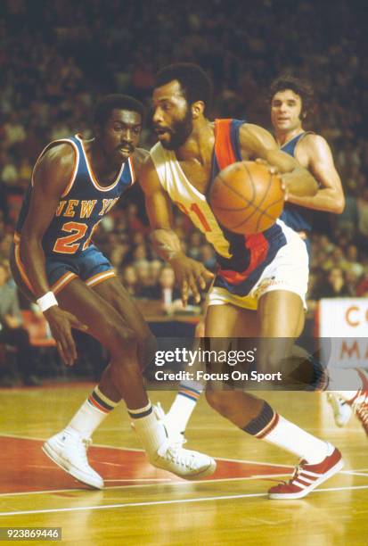 Archie Clark of the Baltimore Bullets drives on Earl Monroe of the New York Knicks during an NBA basketball game circa 1971 at the Baltimore Civic...