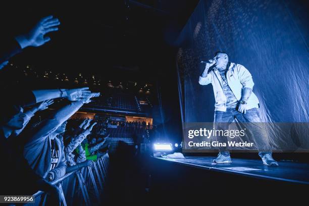 German rapper Rico Depeka performs live on stage in support of Kontra K during a concert at the Max Schmeling Halle on February 24, 2018 in Berlin,...