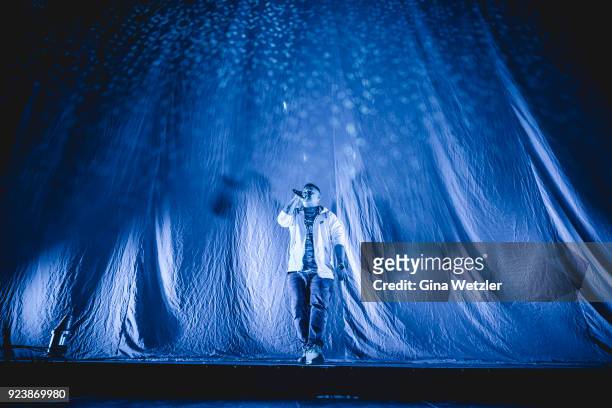 German rapper Rico Depeka performs live on stage in support of Kontra K during a concert at the Max Schmeling Halle on February 24, 2018 in Berlin,...