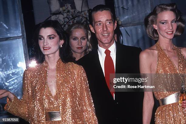 Halston and the Halstonettes at a perfume launch held at Saks 5th Ave., New York, ca.1980s.