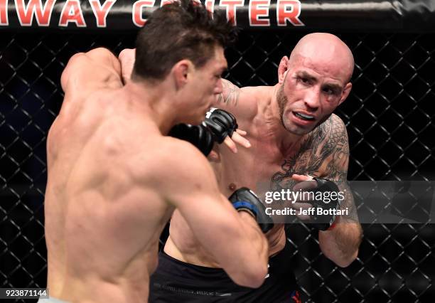 Ben Saunders punches Alan Jouban in their welterweight bout during the UFC Fight Night event at Amway Center on February 24, 2018 in Orlando, Florida.