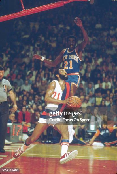 Archie Clark of the Baltimore Bullets drives on Earl Monroe of the New York Knicks during an NBA basketball game circa 1971 at the Baltimore Civic...