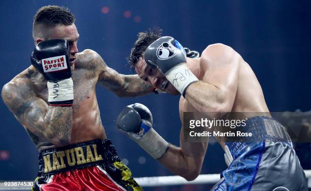 Callum Smith of England exchange punches with Nieky Holzken of Netherlands during the Ali Trophy Super Middleweight Semi-Final fight at Arena...