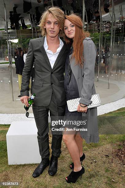 Jamie Campbell Bower and guest attend the annual summer party at The Serpentine Gallery on July 9, 2009 in London, England.