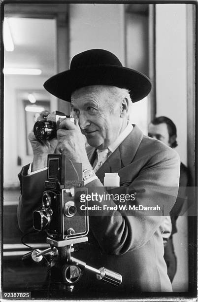 Portrait of British fashion photographer Cecil Beaton as he takes photographs in Andy Warhol's studio, the Factory , New York, New York, April 24,...