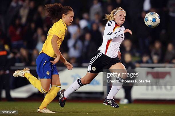 Catrine Johansson of Sweden and Annika Doppler of Germany fight for the ball during the women's international friendly match between Germany U19 and...