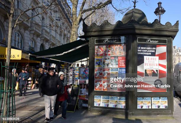 Newspaper kiosks advertise the French translation of Michael Wolff's book on Donald Trump Fire and Fury on February 23, 2018 in Paris, France. The...