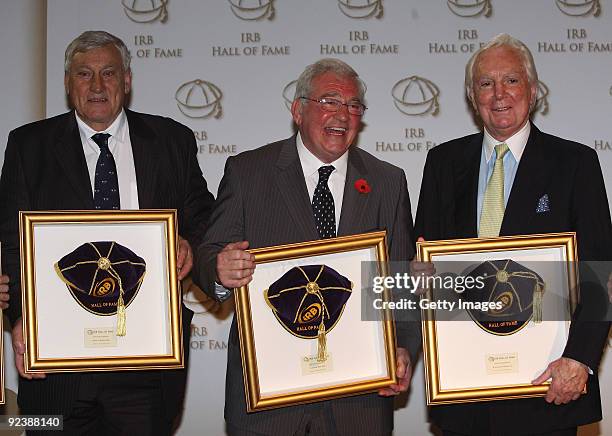 Willie John McBride, Dr. Syd Millar and Sir Tony O'Reilly all of Ireland and the Lions hold their awards after being inducted into the IRB Hall of...