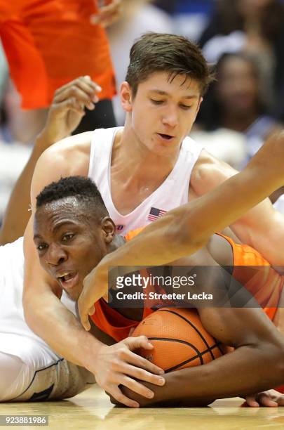 Bourama Sidibe of the Syracuse Orange battles for a loose ball against Grayson Allen of the Duke Blue Devils during their game at Cameron Indoor...