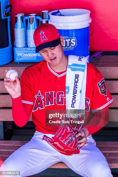 Shohei Ohtani pitcher of the Los Angeles Angels of Anaheim looks on before a game against the Milwaukee Brewers during a Spring Training Game at...