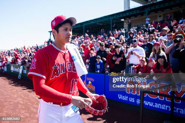 Shohei Ohtani pitcher of the Los Angeles Angels of Anaheim walks to the dugout before a game against the Milwaukee Brewers during a Spring Training...